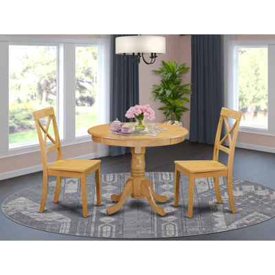 L'ensemble de table de salle à manger 3 pièces comprend une table de cuisine ronde avec piédestal et 2 chaises de cuisine, chêne