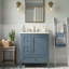 Meuble-lavabo autoportant moderne de 24 po avec comptoir en céramique intégré, armoire de rangement simple à pieds en bois massif avec 3 tiroirs à fermeture en douceur, porte d'armoire et support de rangement intégré, montage sur robinet central (offert en blanc et bleu)-129699120