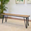 Banc de salle à manger industriel Aryven en bois, fini pin foncé rustique, idéal pour des assises confortables et élégantes.