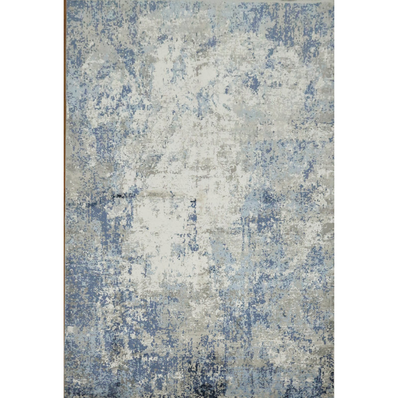 Tapis moderne et artistique avec des tons de bleu et de gris doux 5 x 8