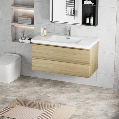 Meuble-lavabo flottant avec lavabo, mural et peu encombrant, idéal pour la conception et l'organisation de salles de bain modernes.