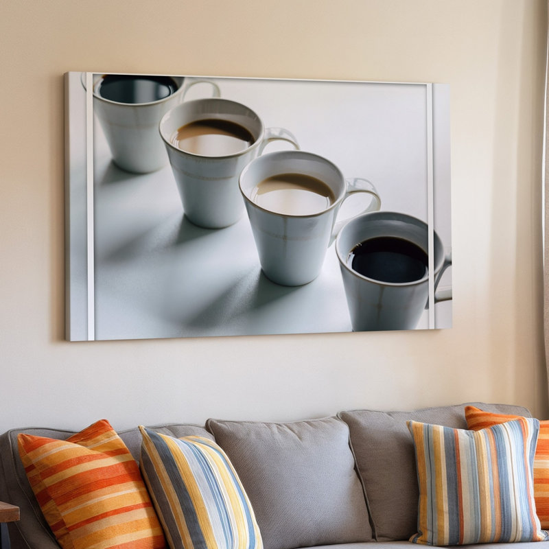 Toile, composition minimaliste avec quatre tasses à café en céramique disposées en art mural, une ligne droite sur une surface blanche immaculée