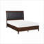 Grand lit-bateau de style transitionnel, tête de lit capitonnée en faux bois de merisier capitonné