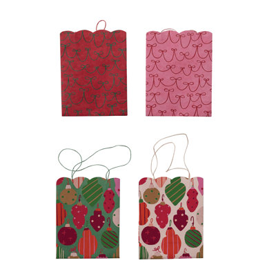 Sac-cadeau en papier festonné avec ornement festif et motif d'arc