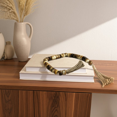 Resin Polyresin Jute Decorative Beads With Tassel Accents Featuring Woven Detailing And Modern Glam Silhouette For Contemporary Display Or Layered Textural Styling In Versatile Arrangements