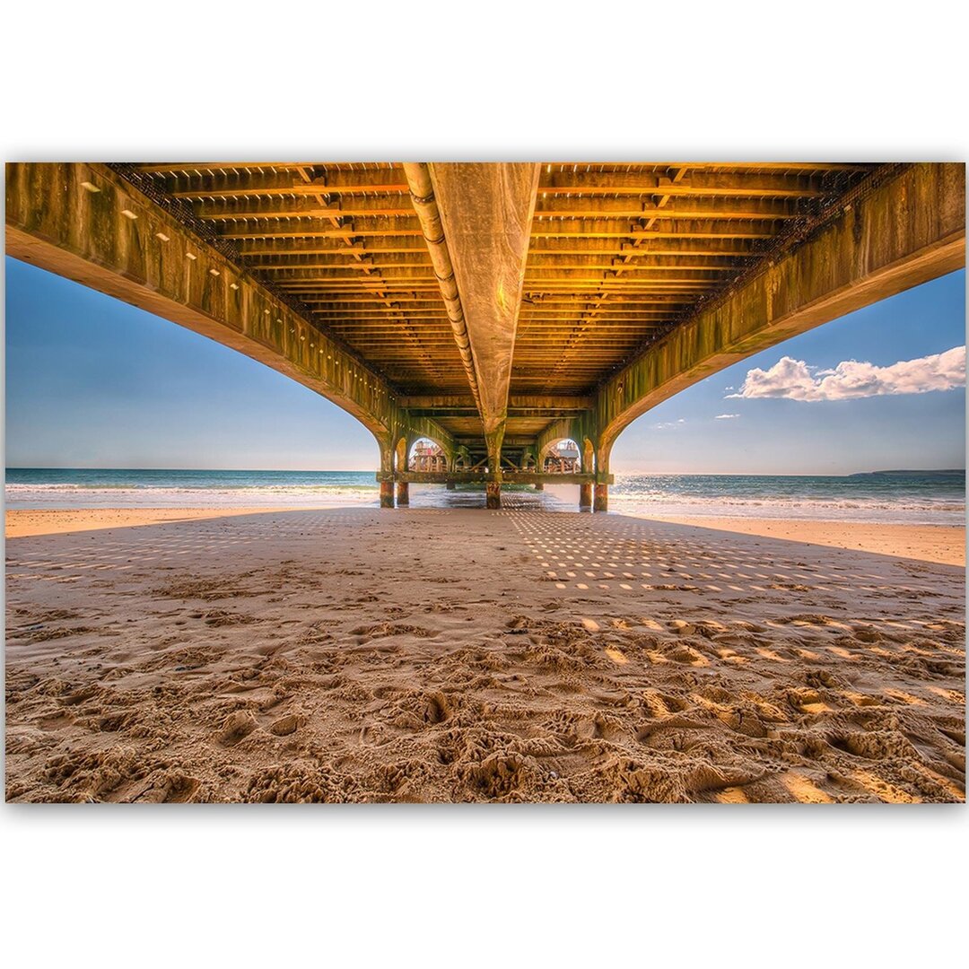 Leinwandbild Strand unter dem Kai