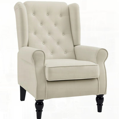 Button-Tufted Upholstered Fabric Armchair With Retro Wood Legs For Stylish Comfort And Timeless Appeal.