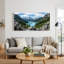 Tableau sur toile représentant des sommets enneigés surplombant un lac turquoise et une forêt de pins-864877721