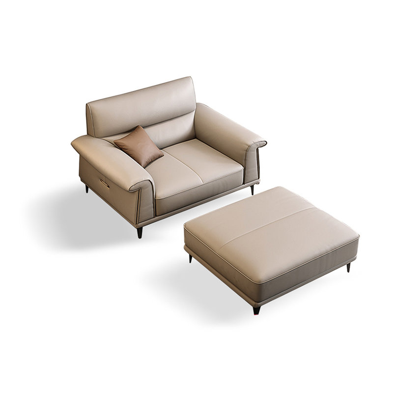 Fauteuil à accoudoirs évasés gris en cuir véritable avec repose-pieds