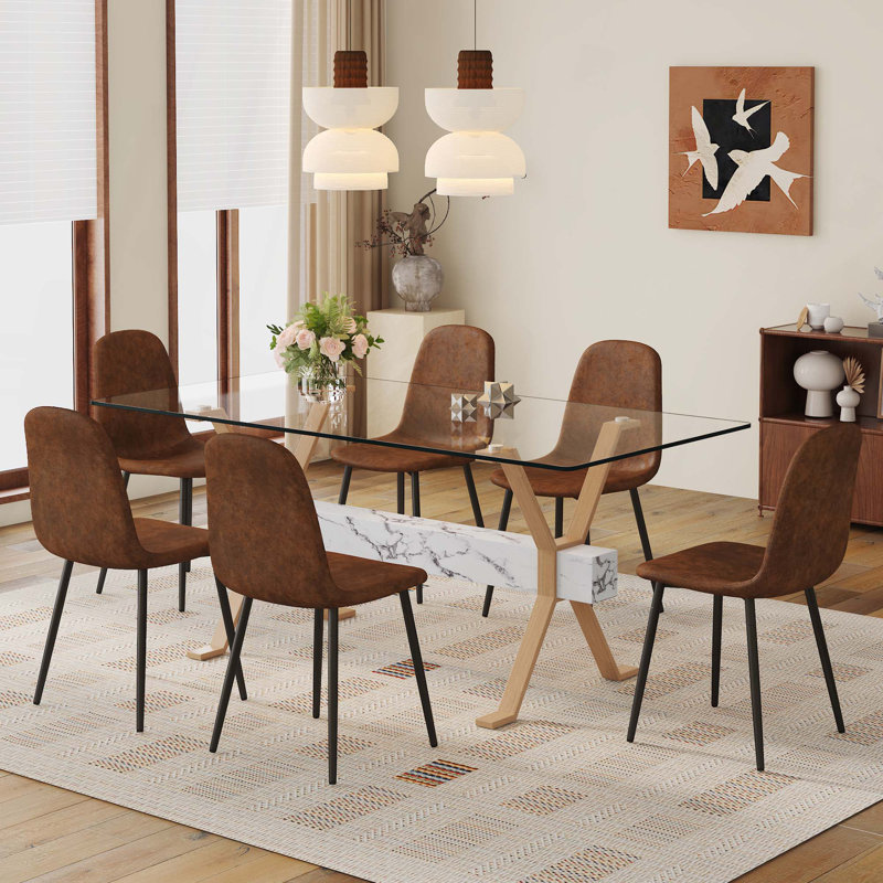 Table de salle à manger transparente en verre trempé avec 6 chaises et pieds en métal. Grande table avec pieds en X en métal