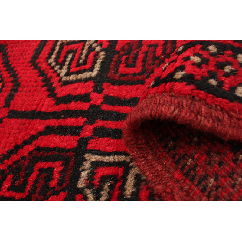 Tapis rouge en laine noué à la main