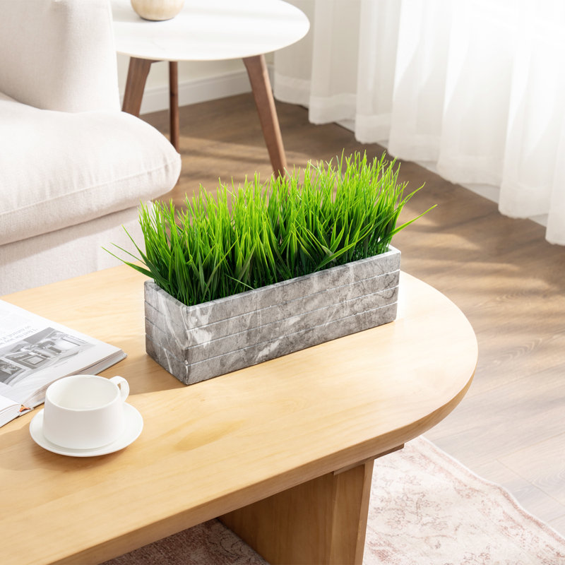 Herbes vertes artificielles d'intérieur
