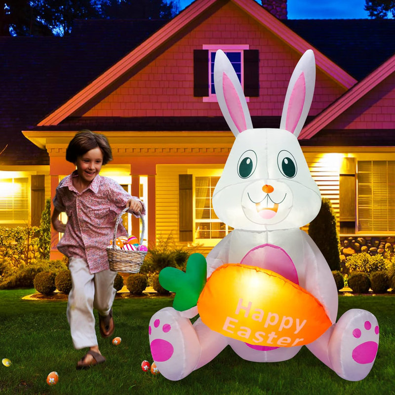 Lapin de Pâques tenant une carotte gonflable