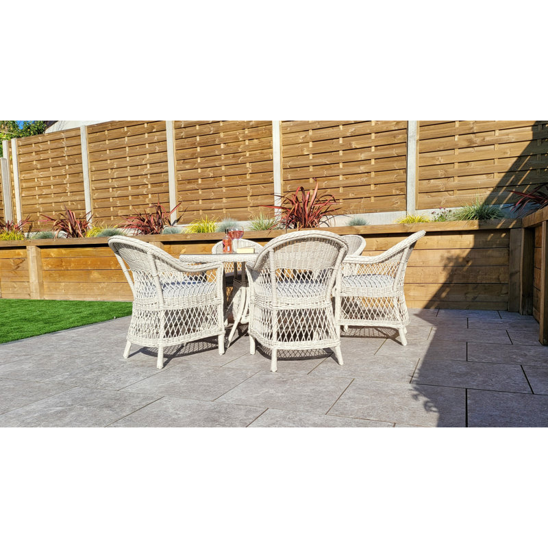 Charda 6 - Person Wicker Patio Dining Set with Round Table , Cushions Included