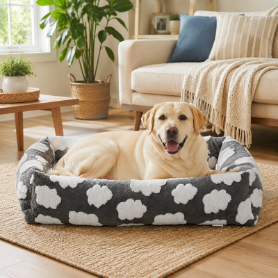 Grey rectangular furry orthopedic bed for medium and large dogs, with a soft surface and removable zipper cover that is washable.