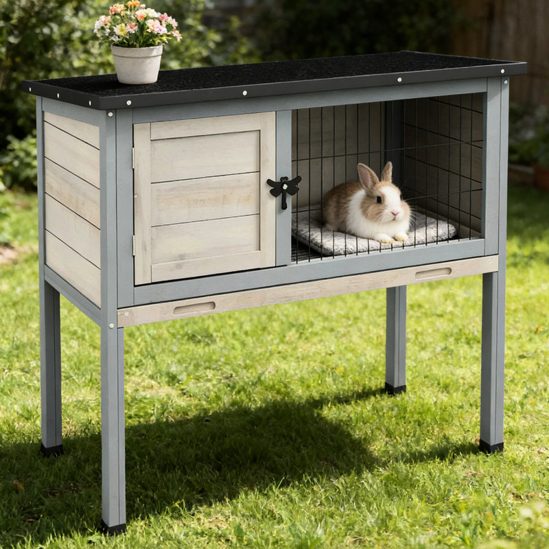 Petite cabane de lapin aux couleurs grise et noire Porte facile d'accès et éléments inférieurs sécuritaires