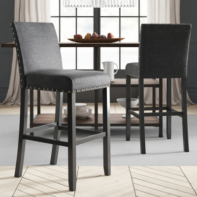 Tabourets de comptoir en tissu avec garniture cloutée Carliana, ensemble de 2