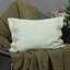 Housse de coussin en lin à boutons