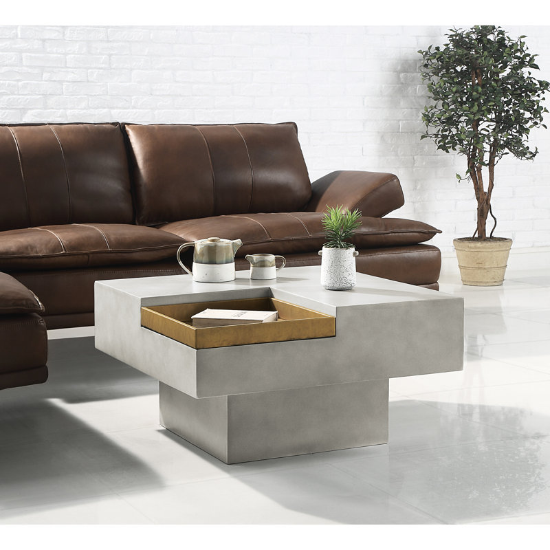 Fabuleuse table basse en ciment gris avec beaucoup d'espace de rangement