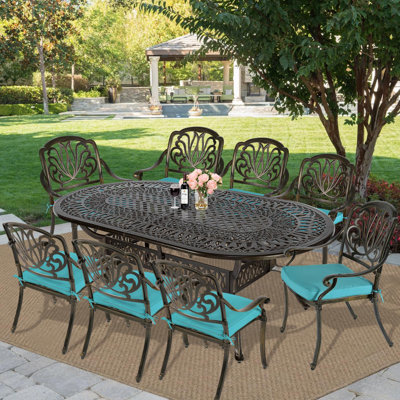 8 - Person Patio Dining Set Umbrella Hole Included Oval Table with Cushions Included