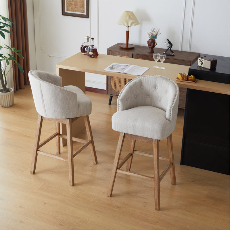 Ensemble de 2 tabourets de comptoir pivotants élégants, rembourrés avec une structure en bois massif, de conception ergonomique pour un confort et une durabilité ultimes.