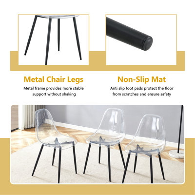 Ensemble de table et de chaises Table de salle à manger ovale en verre trempé de 71 pouces de style luxueux à double colonne noire. Jumelé avec 6 chaises en plastique transparent avec pieds en métal noir.