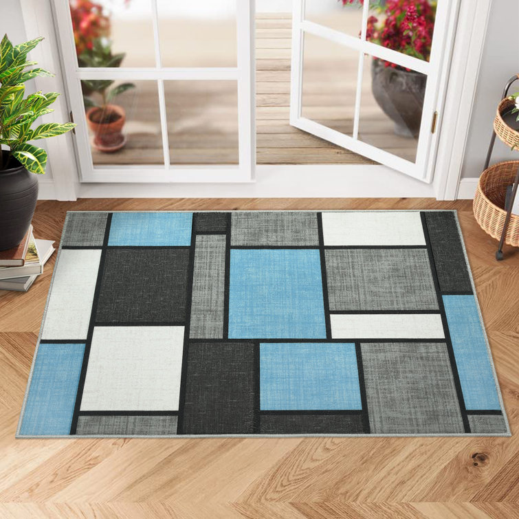 Tapis bleu délavé à motif géométrique lavable