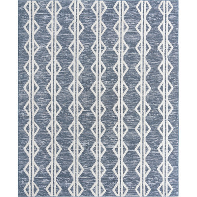 Tapis contemporain Eiryn de couleur bleu marine