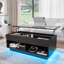 Table basse à plateau relevable Chappa avec bande lumineuse à DEL RVB, compartiment caché et tablette ouverte-1140384295