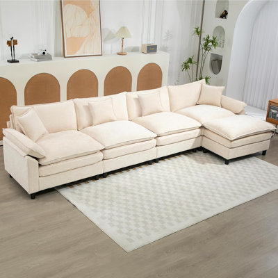 Canapé modulaire rembourré en L avec repose-pieds