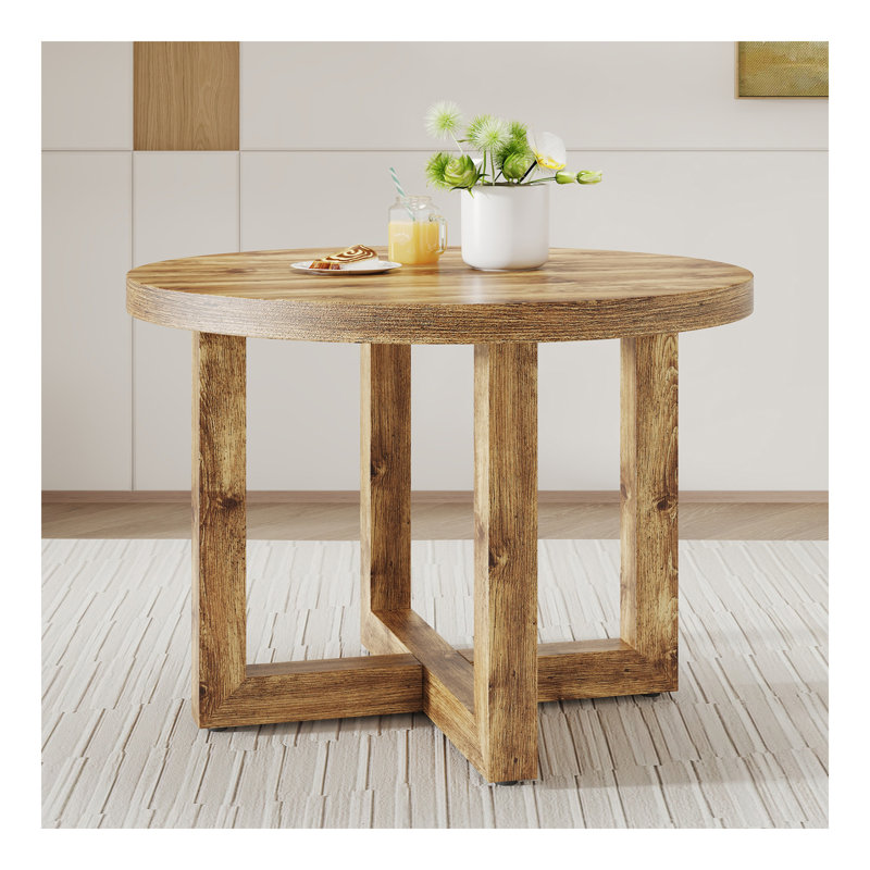 Une table de salle à manger circulaire moderne et pratique. Fabriqué en bois aggloméré et en bois. Convient au salon et à la chambre à coucher.