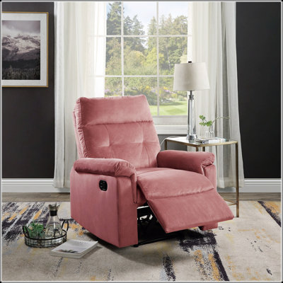 Fauteuil inclinable luxueux en velours rosé avec mouvement manuel, accoudoirs moelleux et dossier capitonné pour le confort du salon