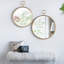 Miroir mural circulaire avec cadre en fer doré-835849099