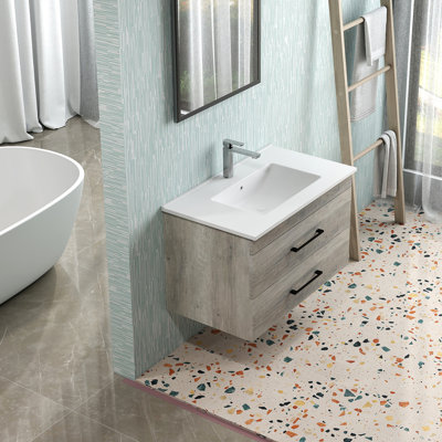 Meuble-lavabo mural 32 po avec deux tiroirs, système de fermeture en douceur, lavabo en céramique, créant un espace de salle de bain moderne et minimaliste