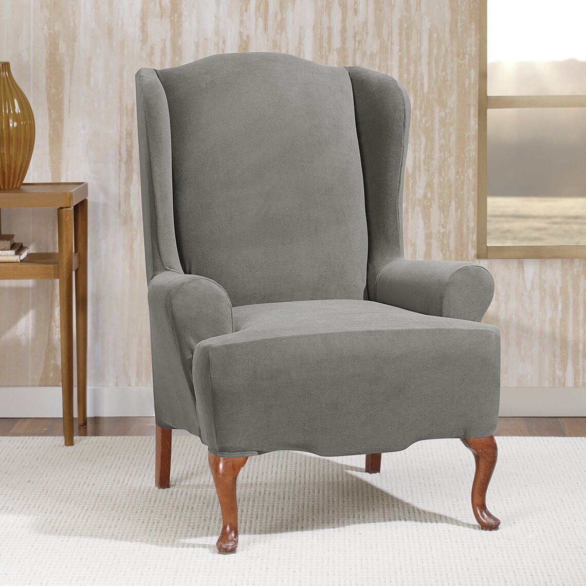 https://assets.wfcdn.com/im/82373866/compr-r85/2968/29689000/stretch-morgan-t-cushion-wingback-slipcover.jpg