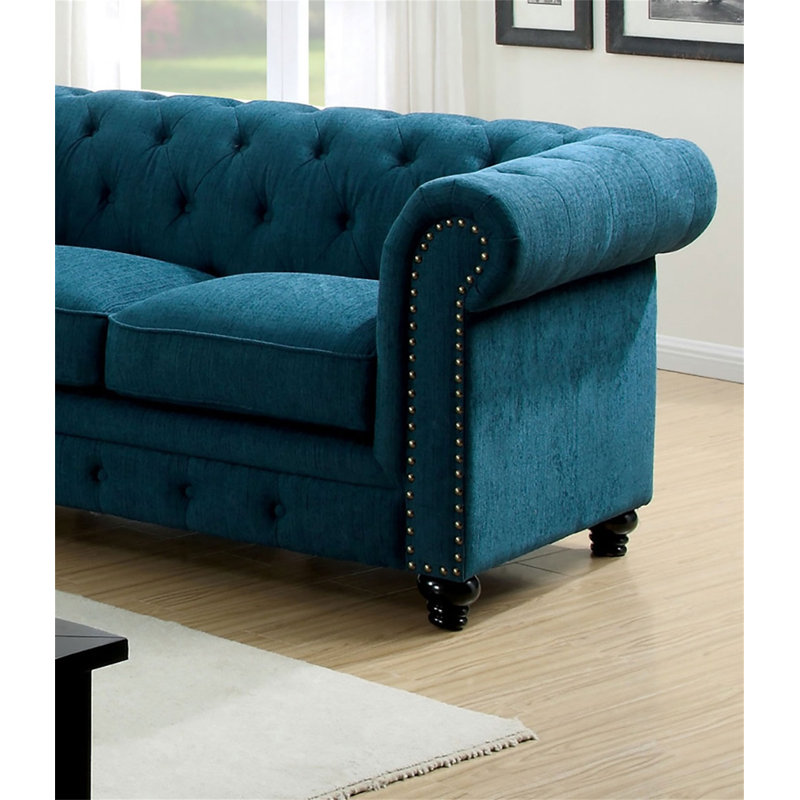 Causeuse contemporaine capitonnée de couleur bleu sarcelle à boutons capitonnés et capitonnée
