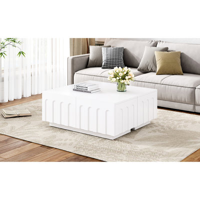 Élégante table basse blanche et meuble télé, quatre tiroirs pour ranger les chargeurs de télécommandes, conception arquée sur tiroir, fabriqué en blanc avec un support de 80 pouces et 4 fonctions de rangement