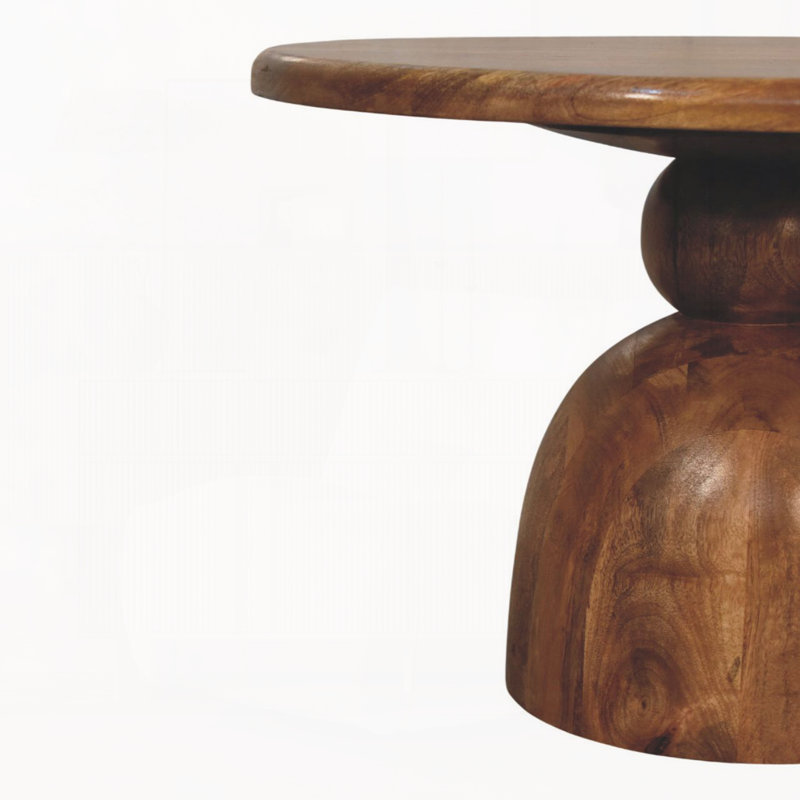 Table basse sur piédestal en bois sculpté