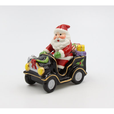 Père Noël au volant d'une voiture sel et poivre