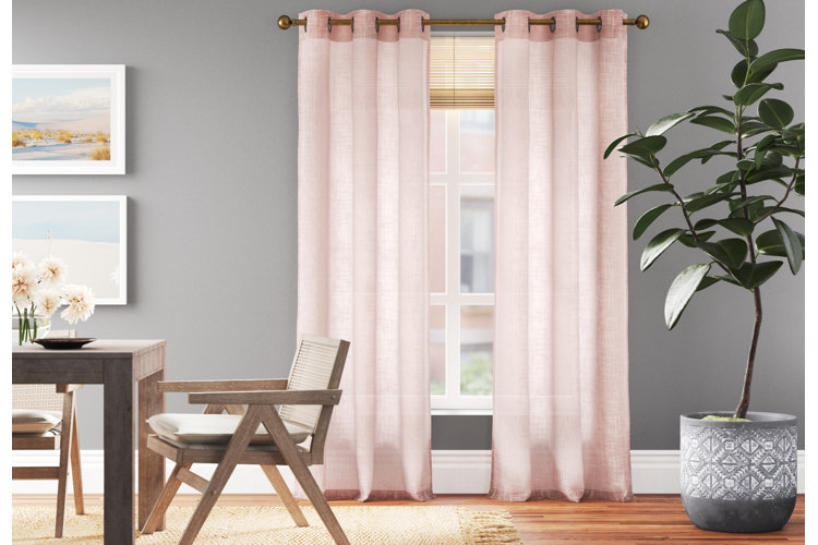 dining room with rose-coloured curtains