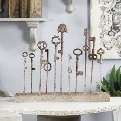 Sculpture sur pied patined keys Atticus