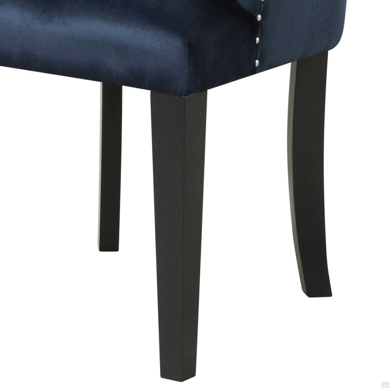 Fauteuil capitonné à dossier