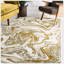 Tapis à motif abstrait beige et doré
