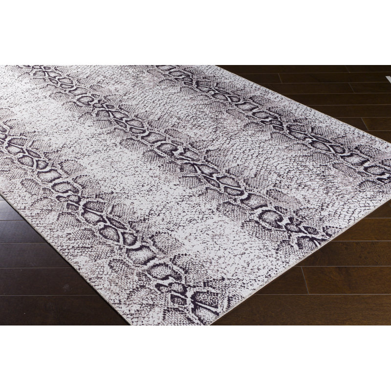 Tapis de zone ivoire/noir à imprimé animal Agalia, Rectangle 2 pi 3 po x 3 pi 9 po