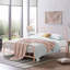 Lit double moderne, cadre en métal rose avec tête de lit arrondie, style industriel