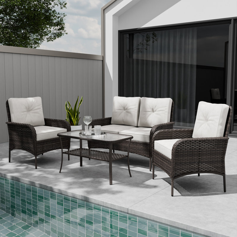 Causeuse d'extérieur en osier brun pour 4 personnes avec coussins beiges et table basse