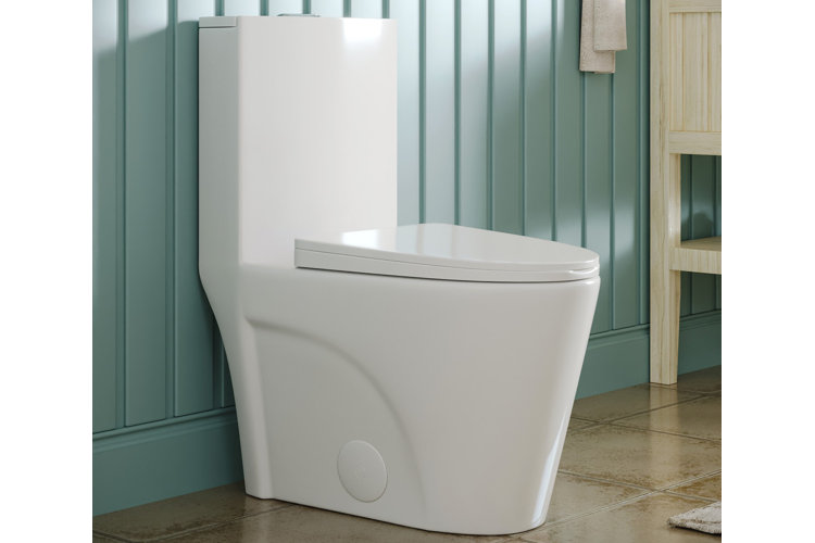 Bathroom with a white elongated toilet and beadboard wall paneling.