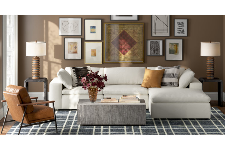 cozy living room with a white sectional and leather accent chair