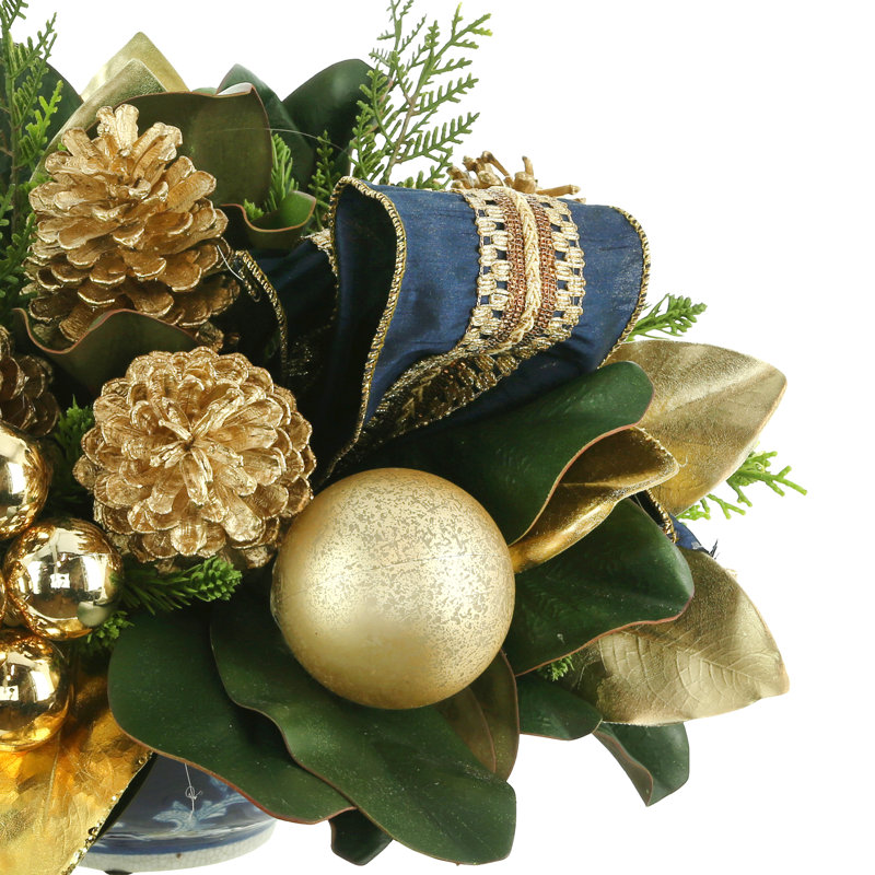 Holiday Arrangement With Magnolia Leaves, Pinecones And Ornaments
