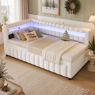Lit de jour moderne rembourré avec éclairage DEL intégré et ports USB, et lit gigogne pratique.